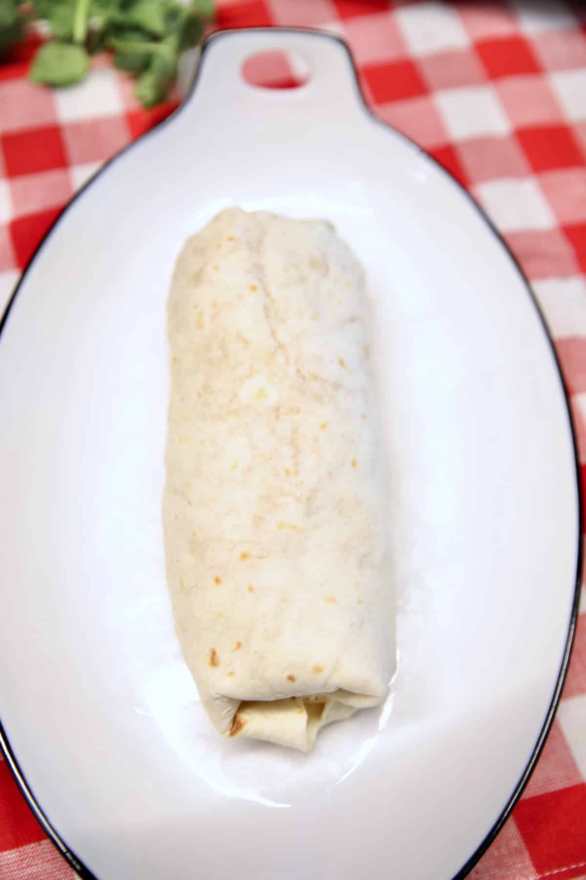 Burrito on a platter.