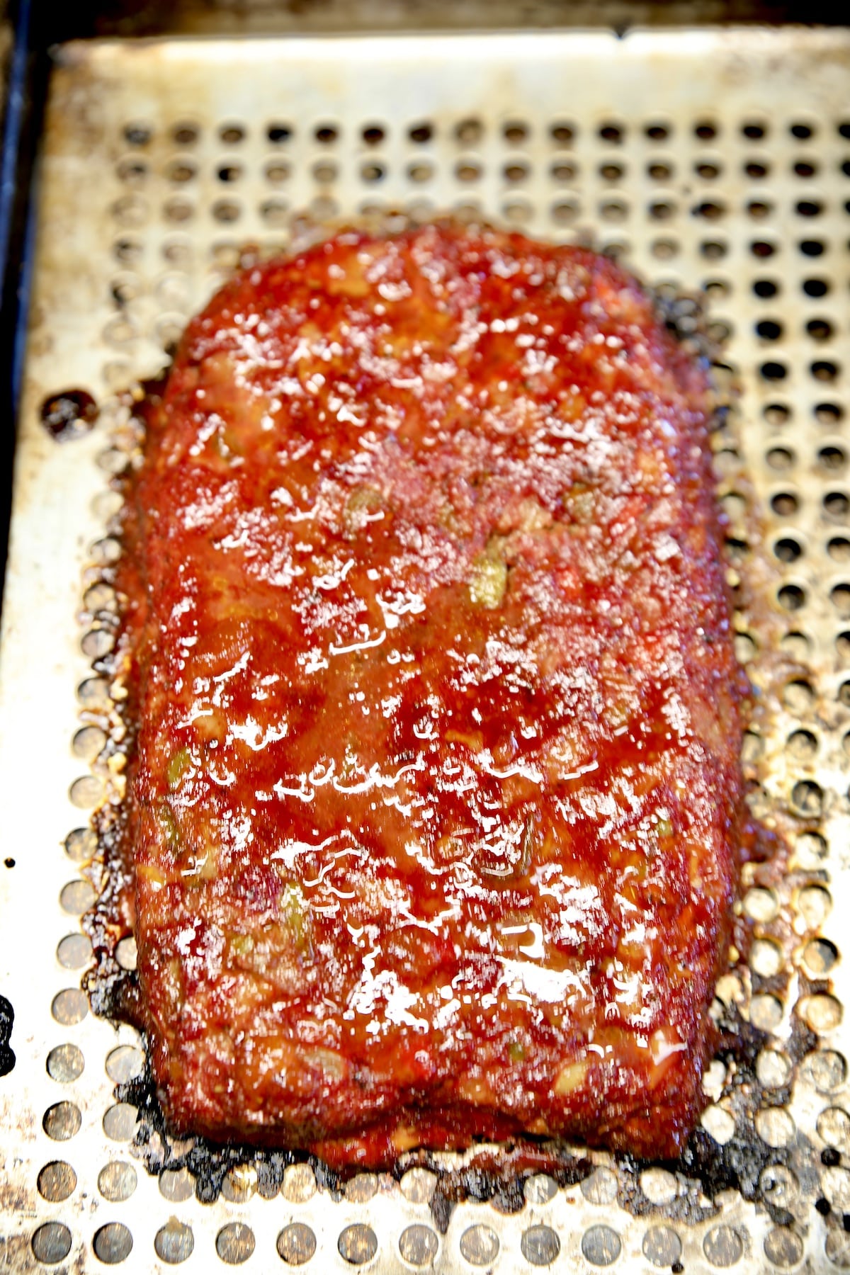 Grilled meatloaf on a grill pan.
