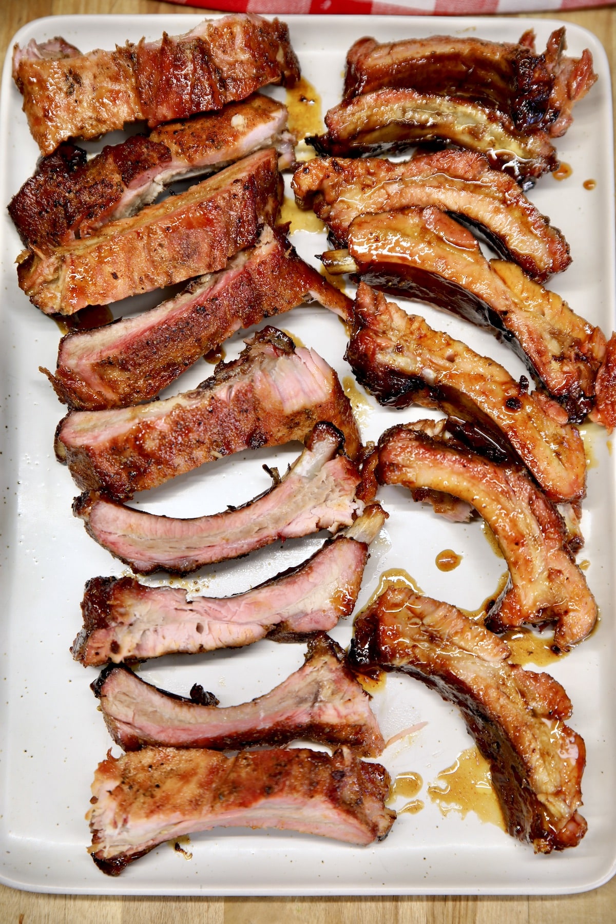 Sheet pan with sliced baby back ribs.