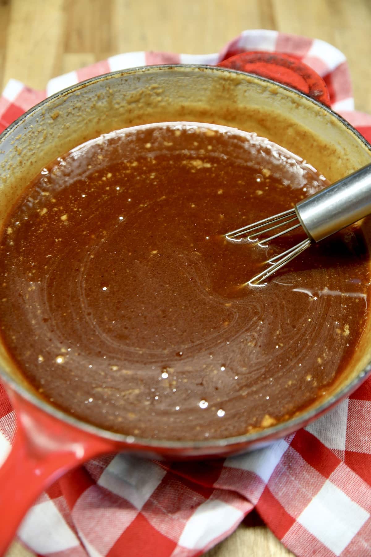 Pan of honey garlic sauce for ribs.