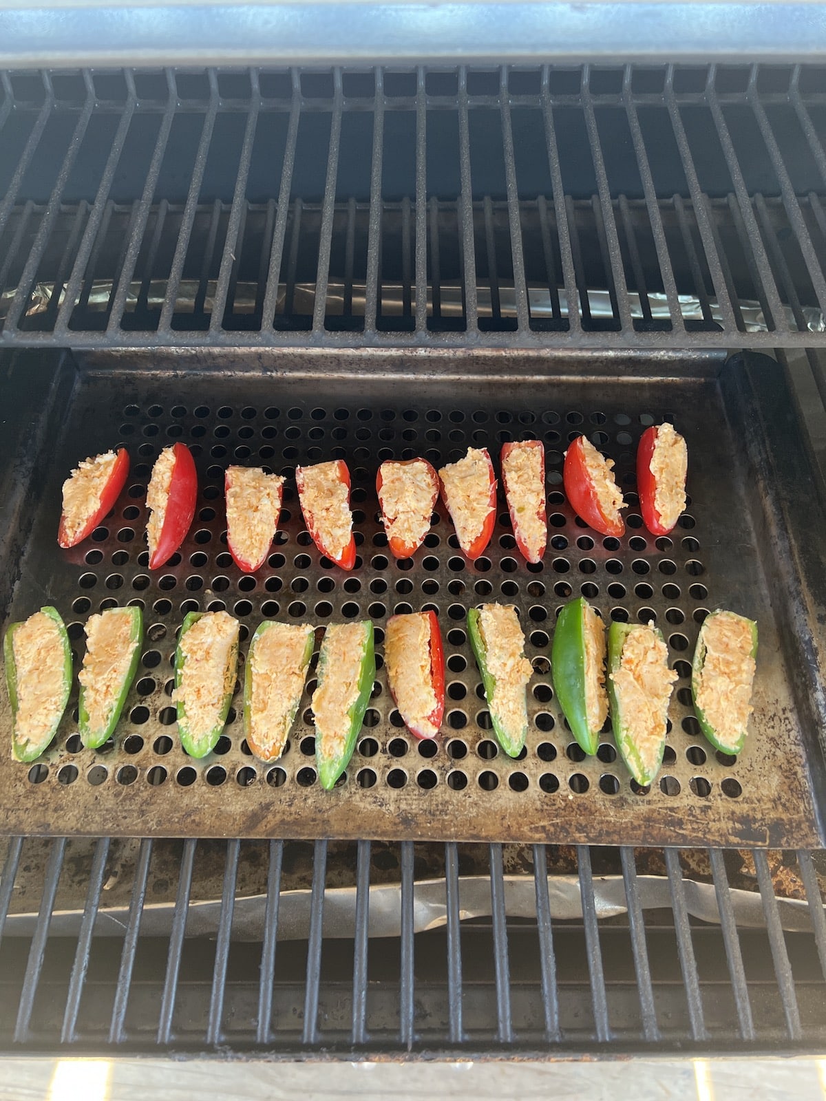 Grilling jalapeno poppers.