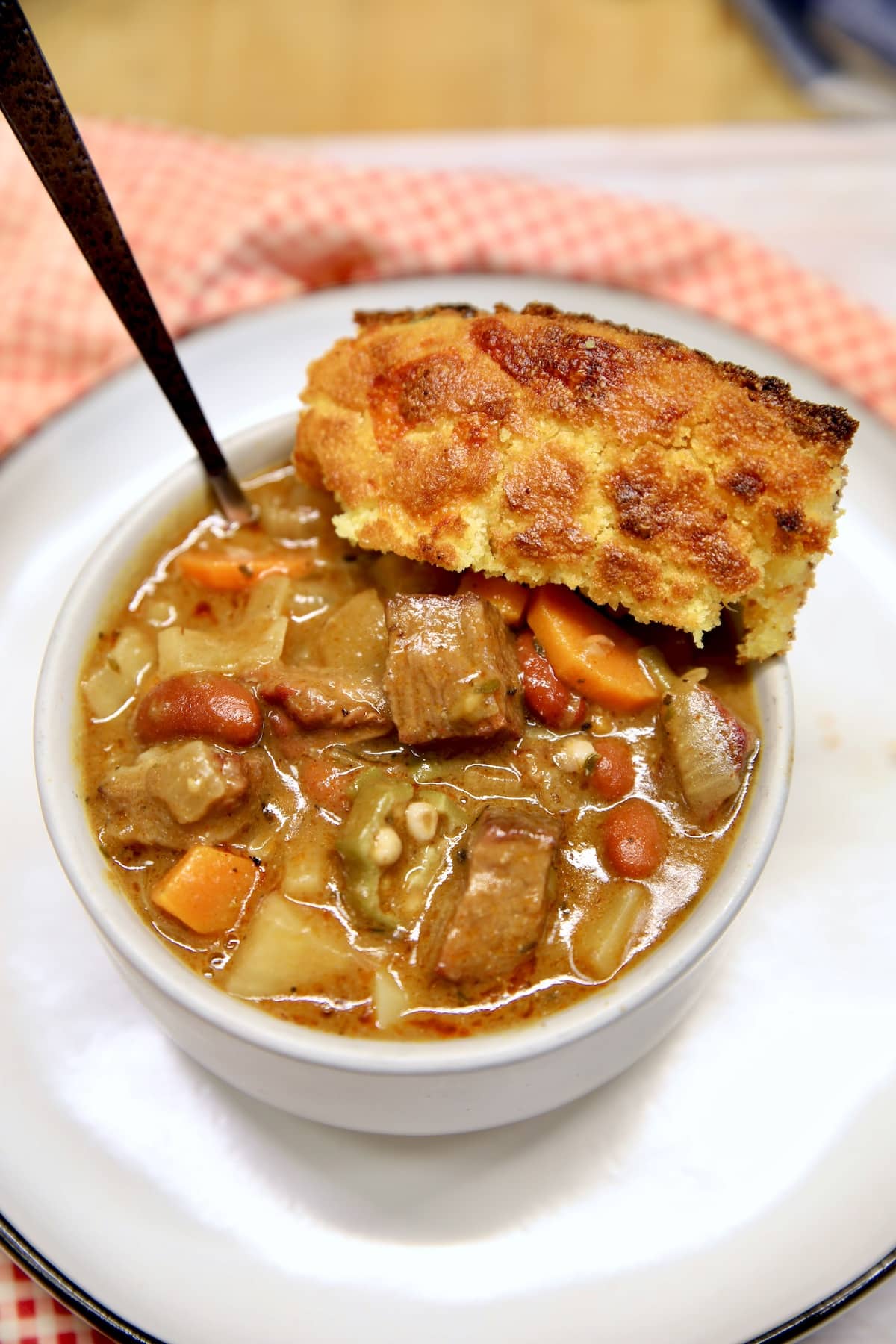 Bowl of beef stew with cornbread.