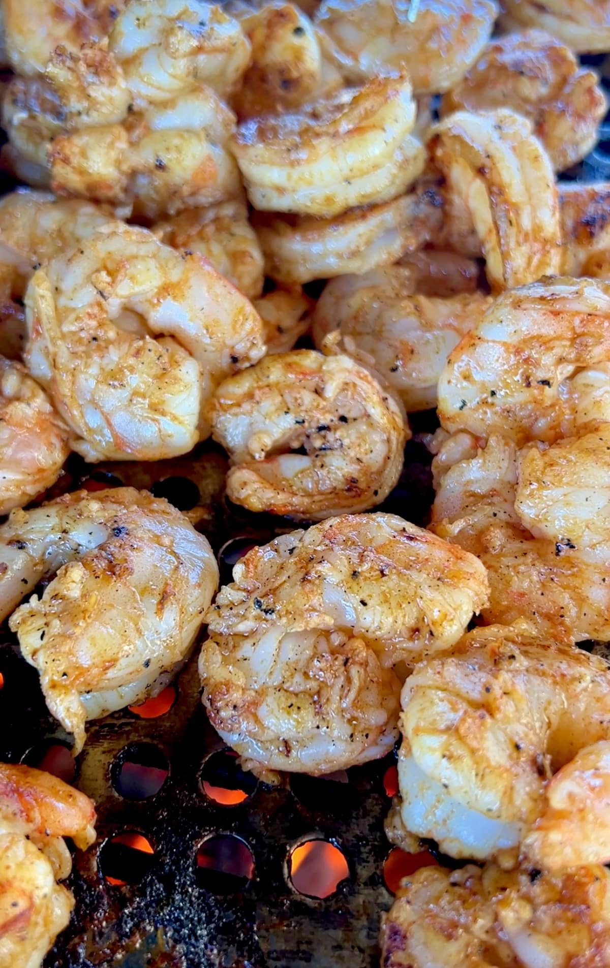 Cooking shrimp on a grill.