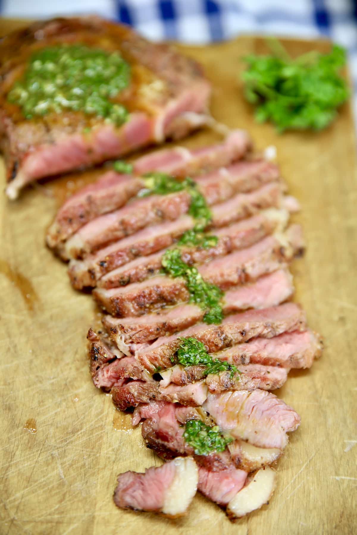Steak chimichurri on a cutting board.