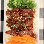 Asian beef with broccoli, carrots and rice.