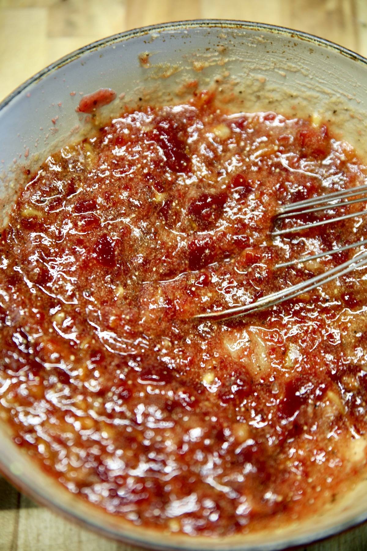 Cranberry orange glaze in saucepan.