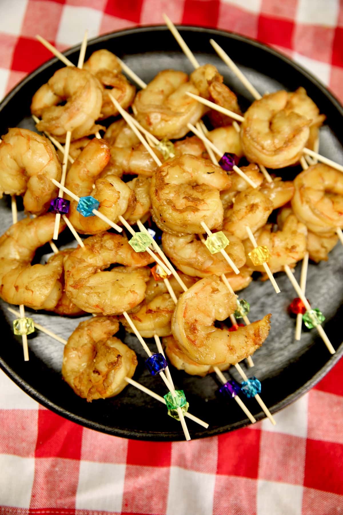 Sesame shrimp appetizer on party picks. 