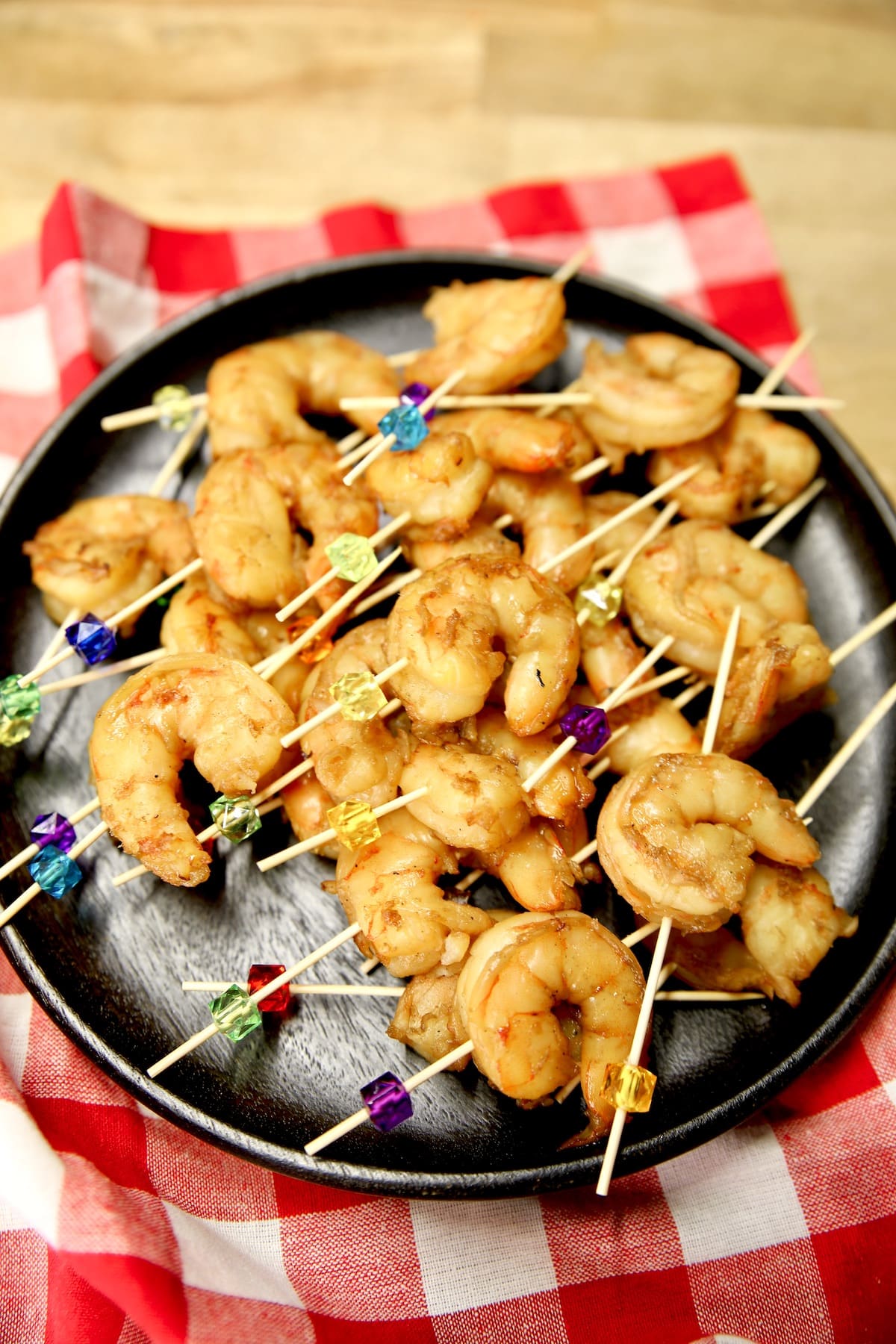 Platter of shrimp on appetizer picks.