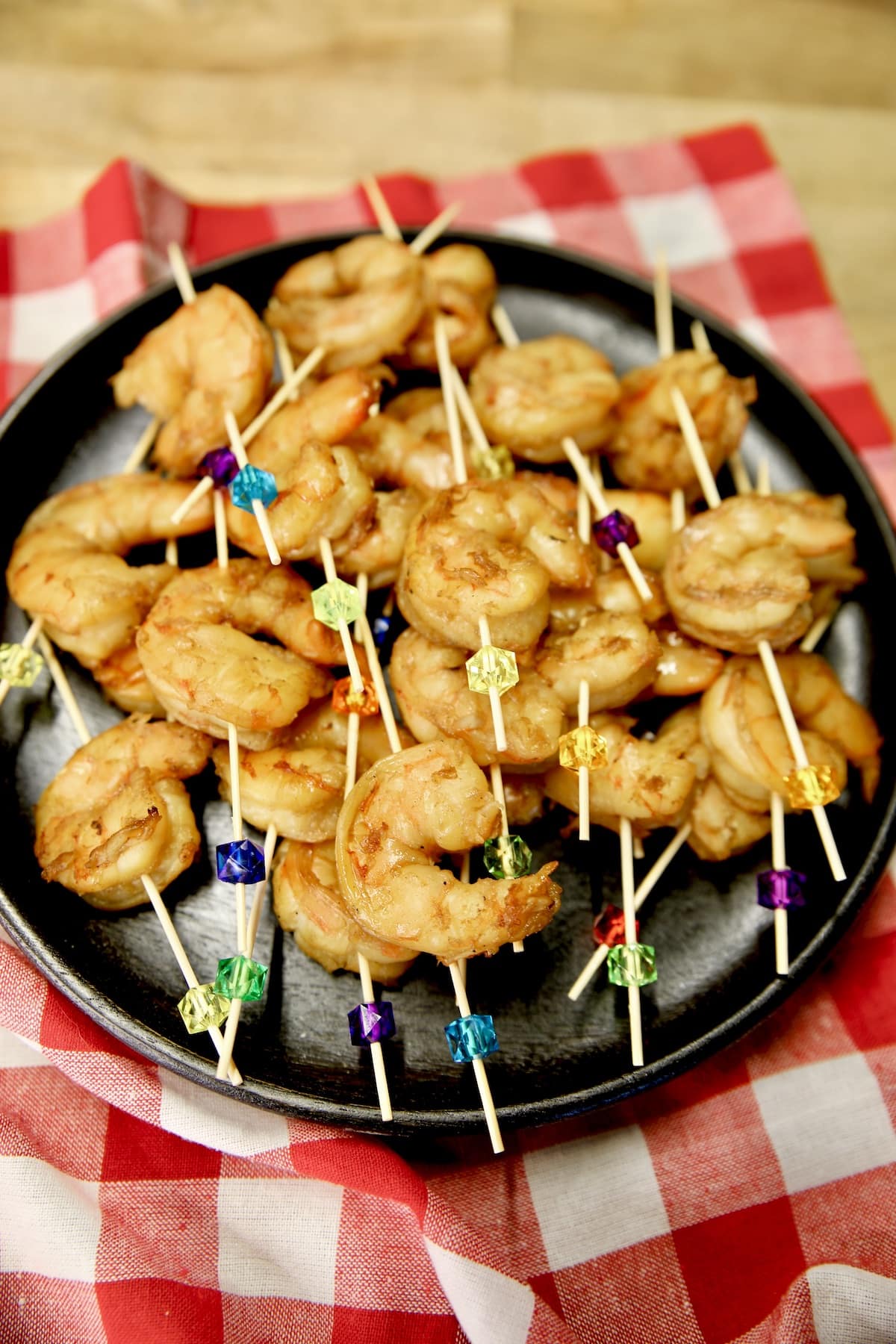 Appetizer shrimp on a platter with picks.