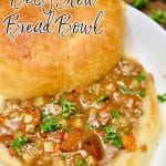 Bread bowls filled with beef stew - text overlay.