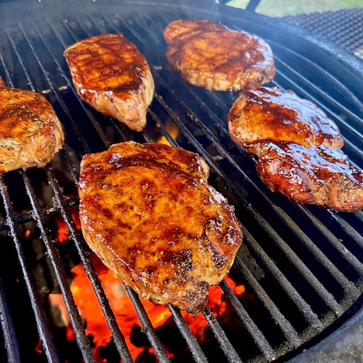 Grilled pork chops on the grill.