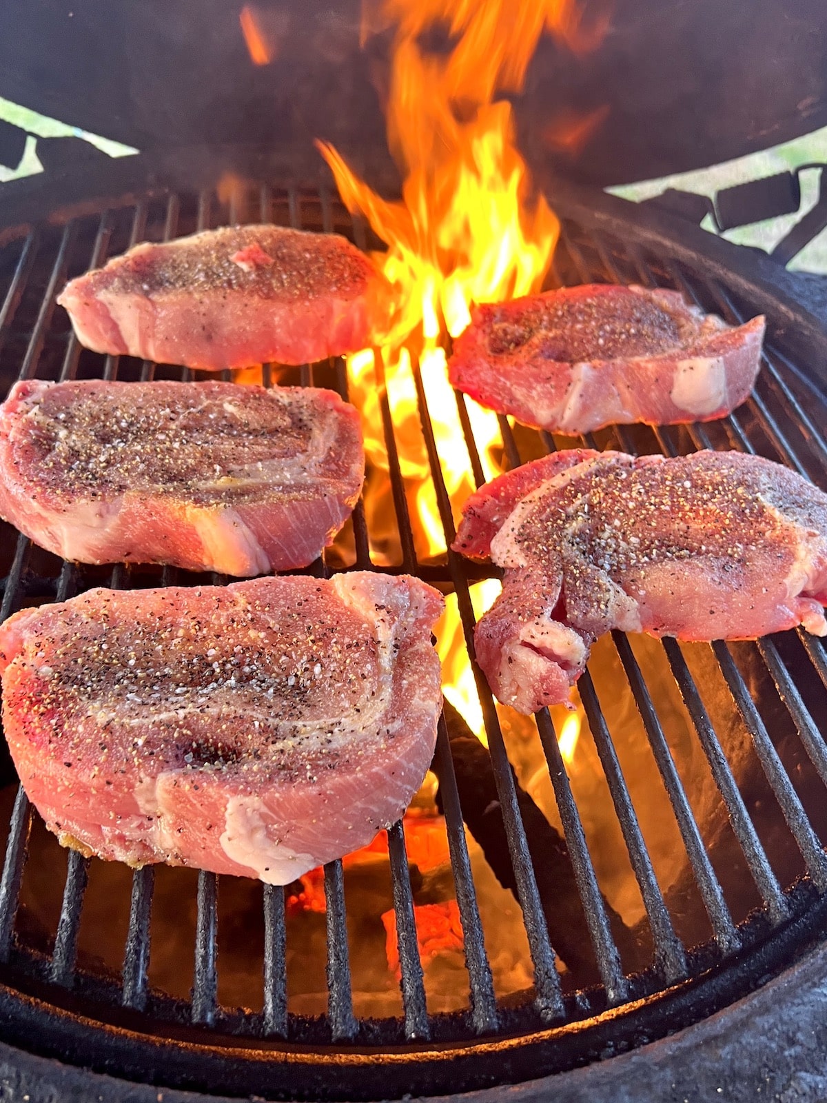 Grilling pork chops - fire flaming.