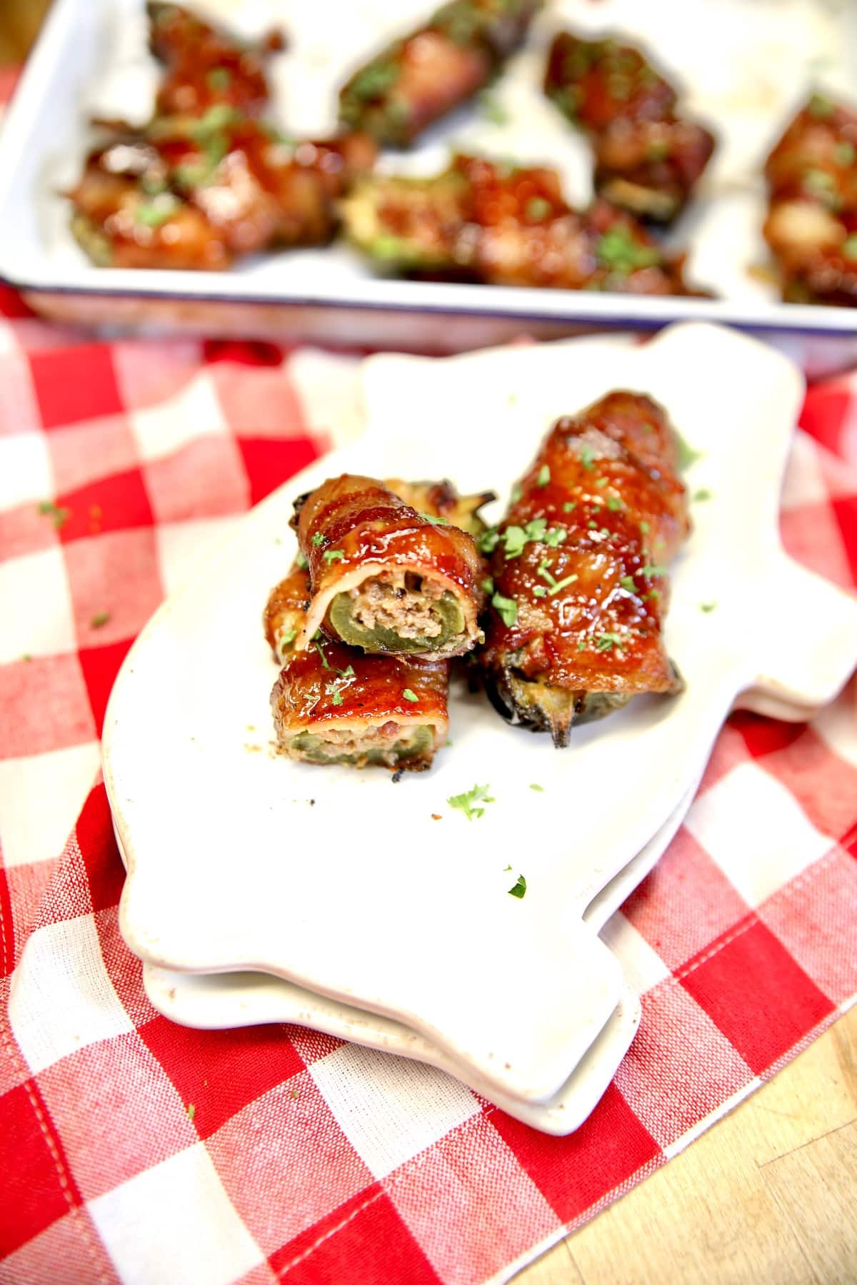 Bacon wrapped jalapenos with ground beef and cheddar.