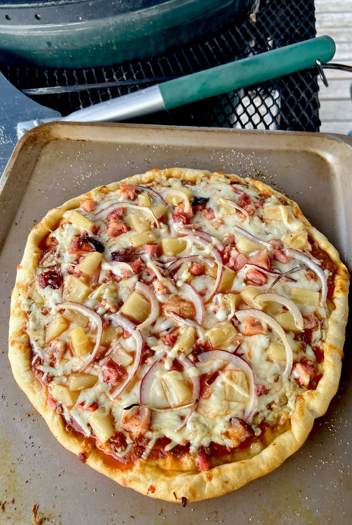 Hawaiian Pizza on a baking sheet.
