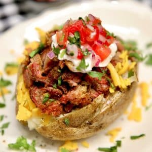 Short rib baked potatoes topped with fresh salsa.