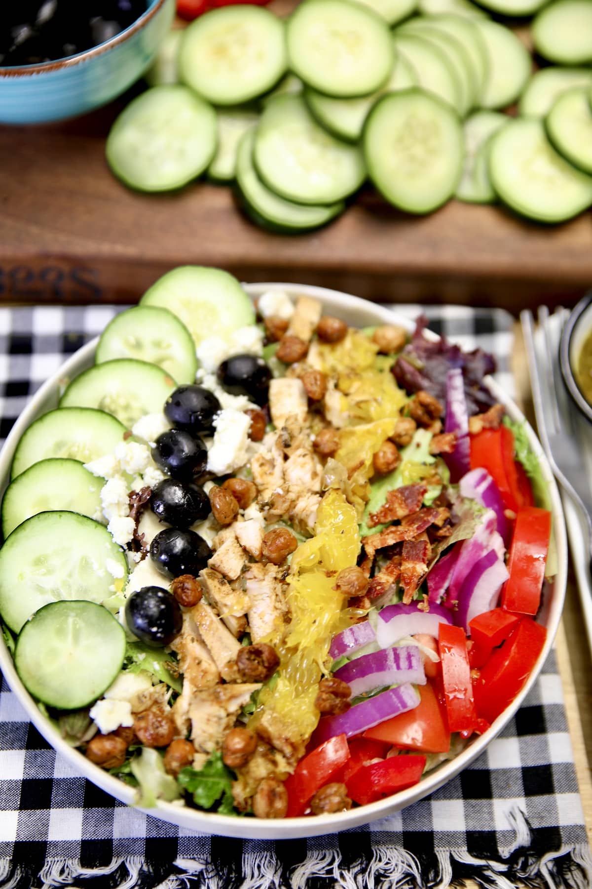Bowl of Greek salad with grilled chicken.