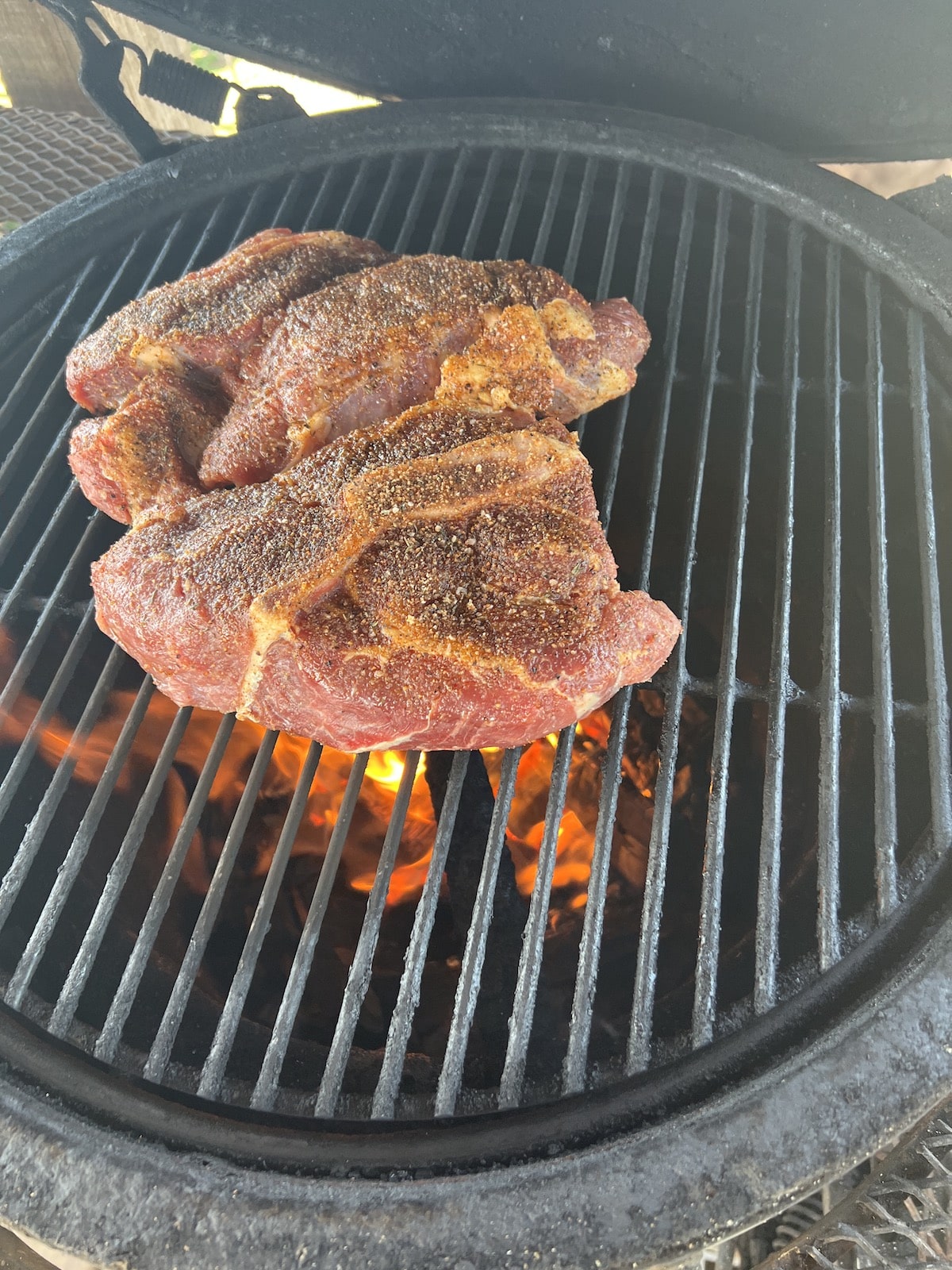 Chuck roast on a grill.