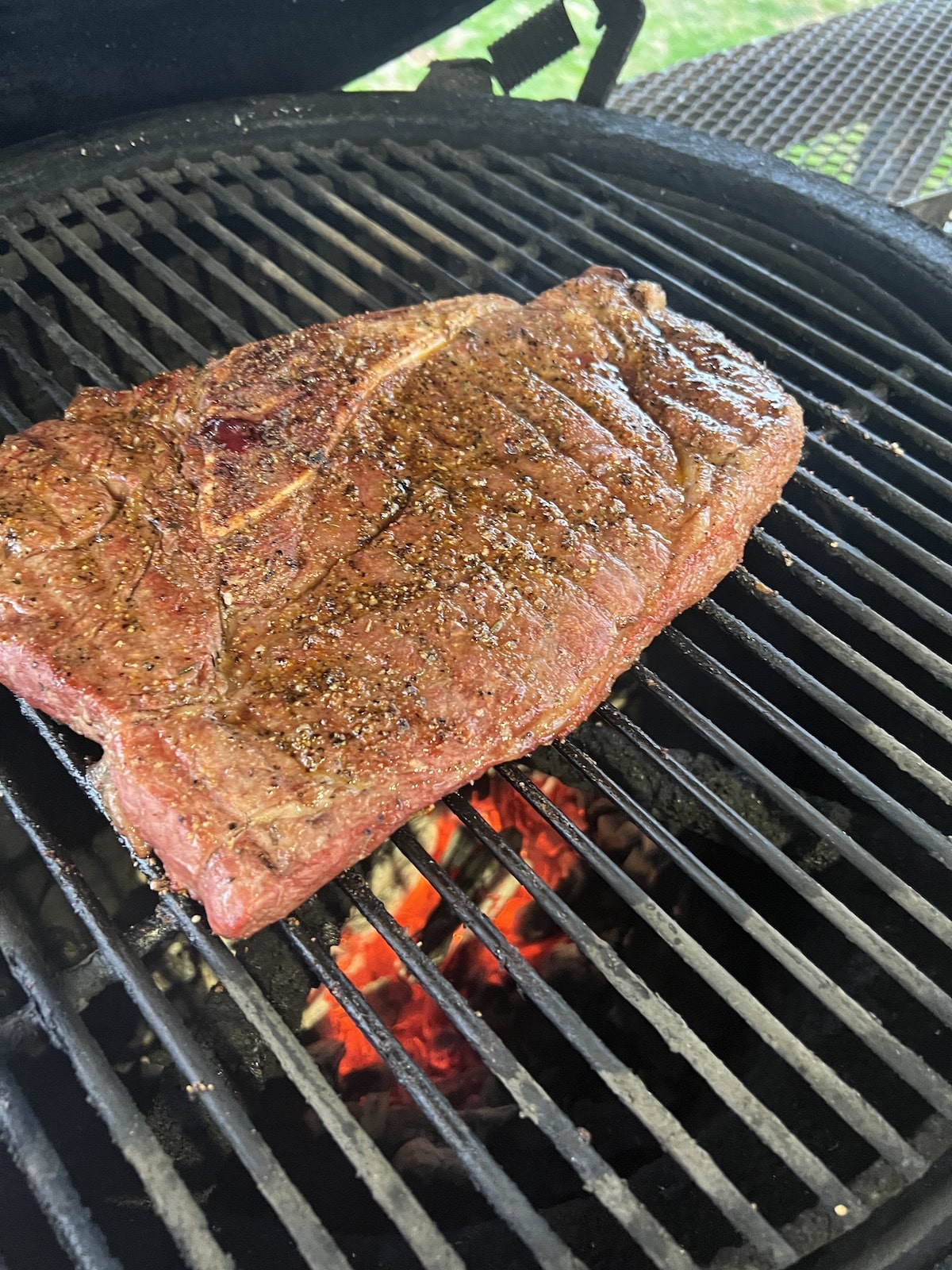 Grilling Sirloin Steak on a charcoal grill.