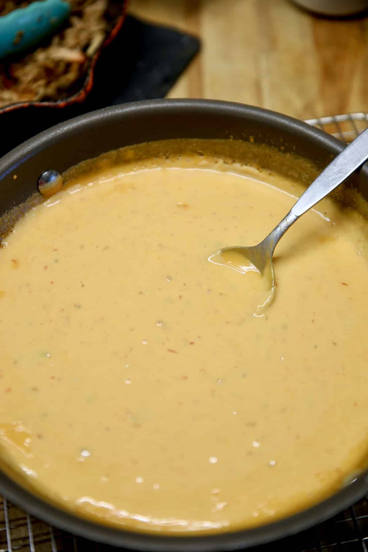 Queso cheese dip in a pan.
