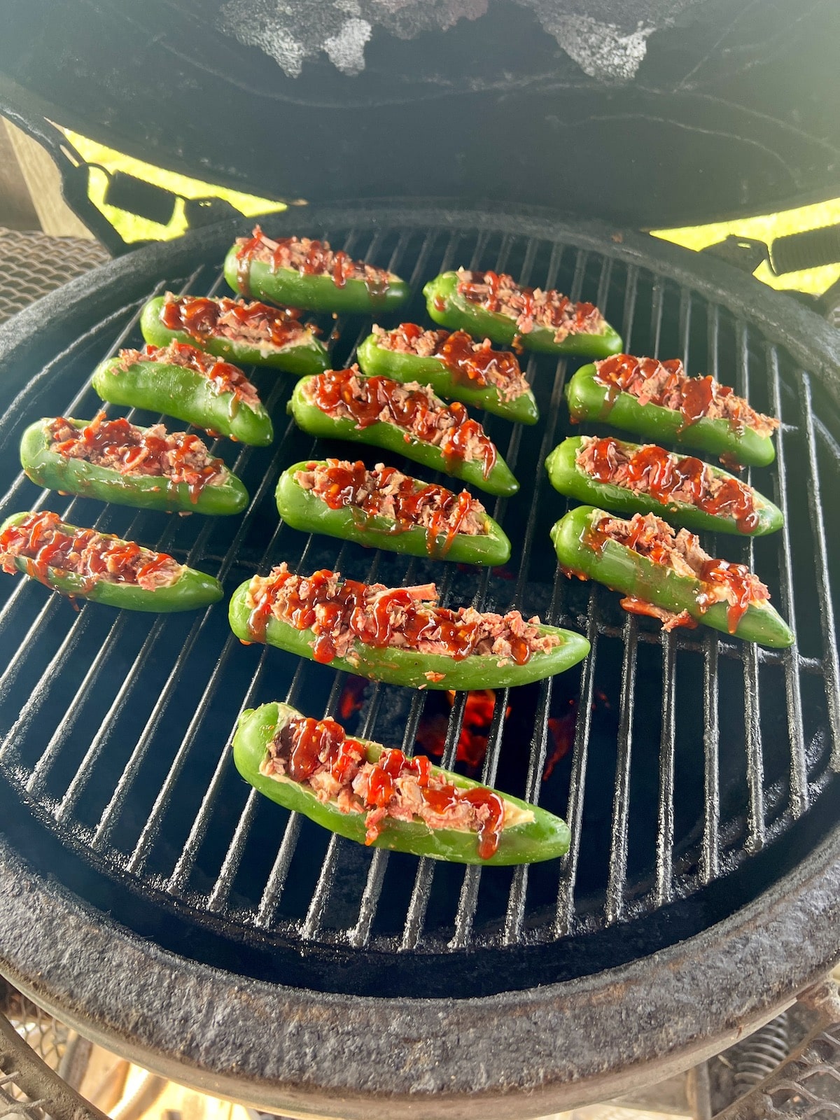 Grill cooking jalapeno poppers.