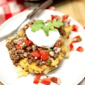 Loaded smashed potatoes with fresh salsa and sour cream.