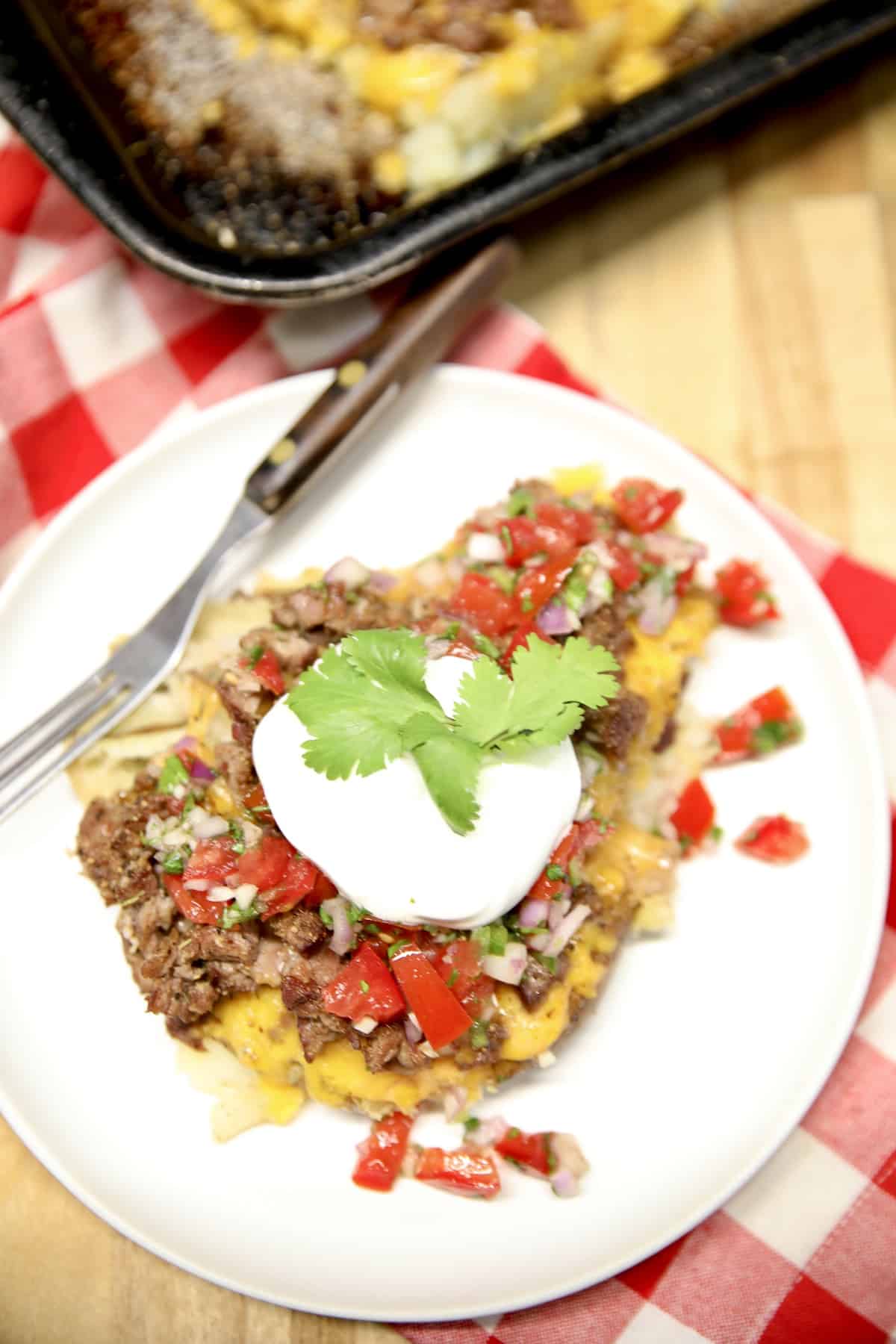 Loaded smashed potatoes with beef, salsa and sour cream.
