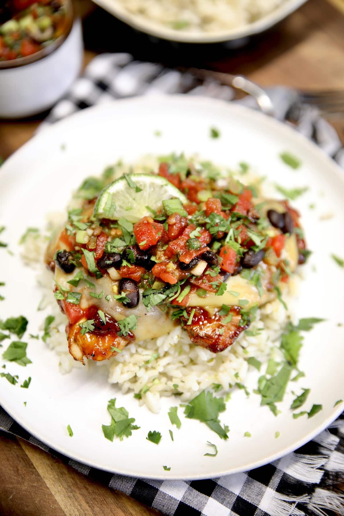 Plate of cilantro rice with grilled chicken and black bean salsa.