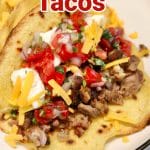 Short rib tacos with cheese and sour cream - text overlay.
