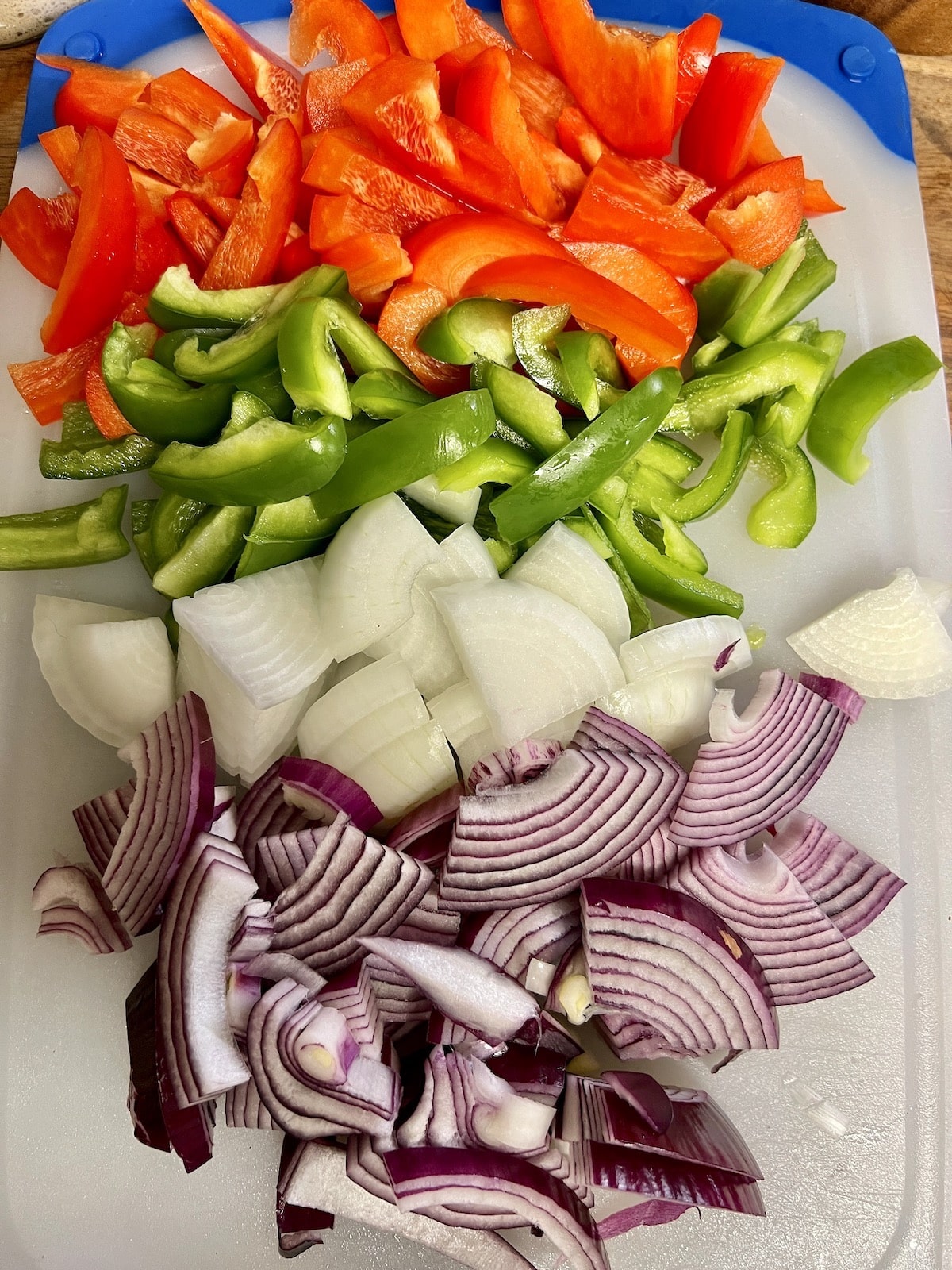 Sliced bell peppers and onions for fajitas.