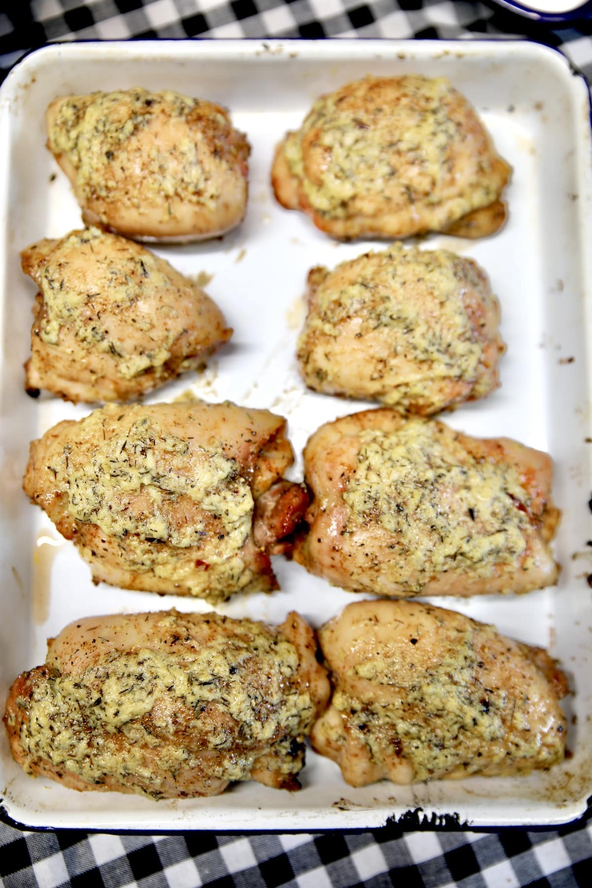 Grilled garlic butter chicken on a platter.