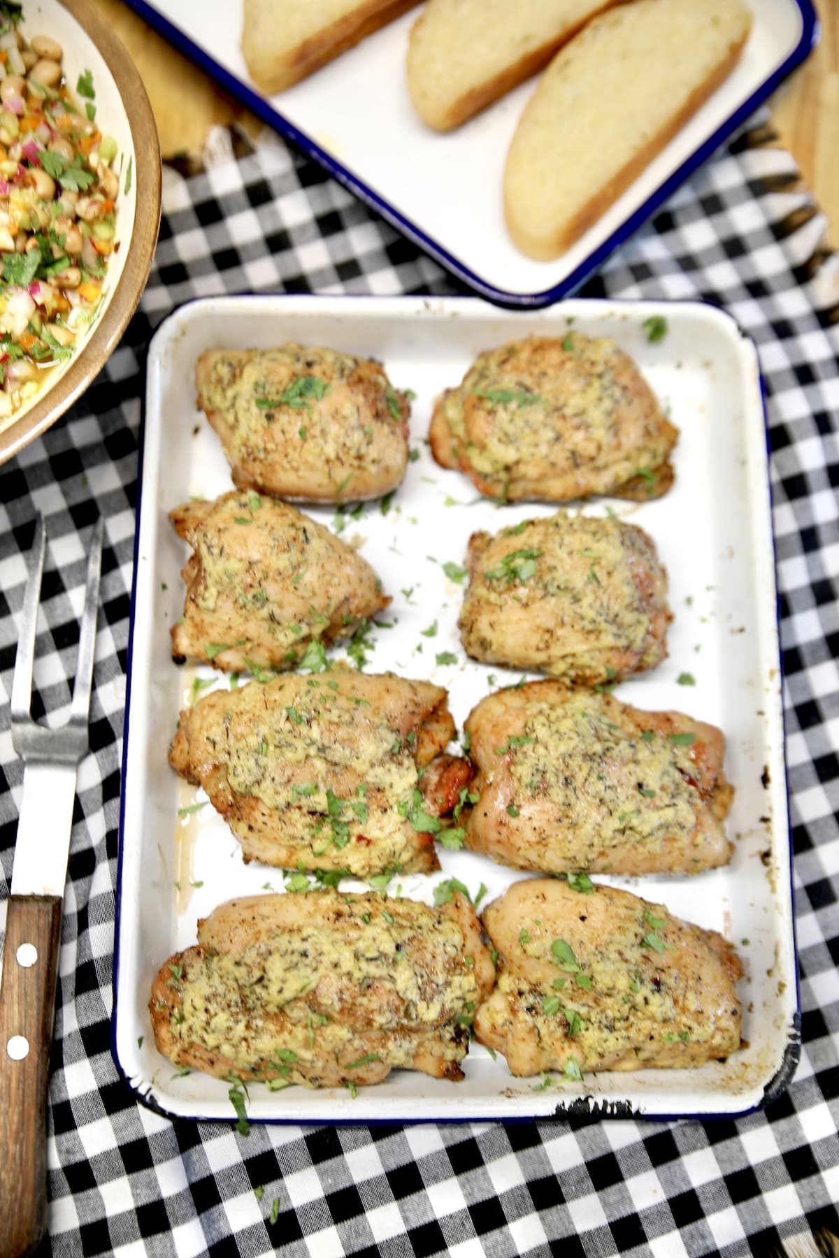 Cowboy butter chicken thighs on a platter.