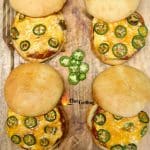 4 grilled burgers with jalapeno cheese filling - text overlay.