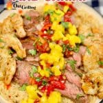 Steak and shrimp bowl with mango salsa - text overlay.