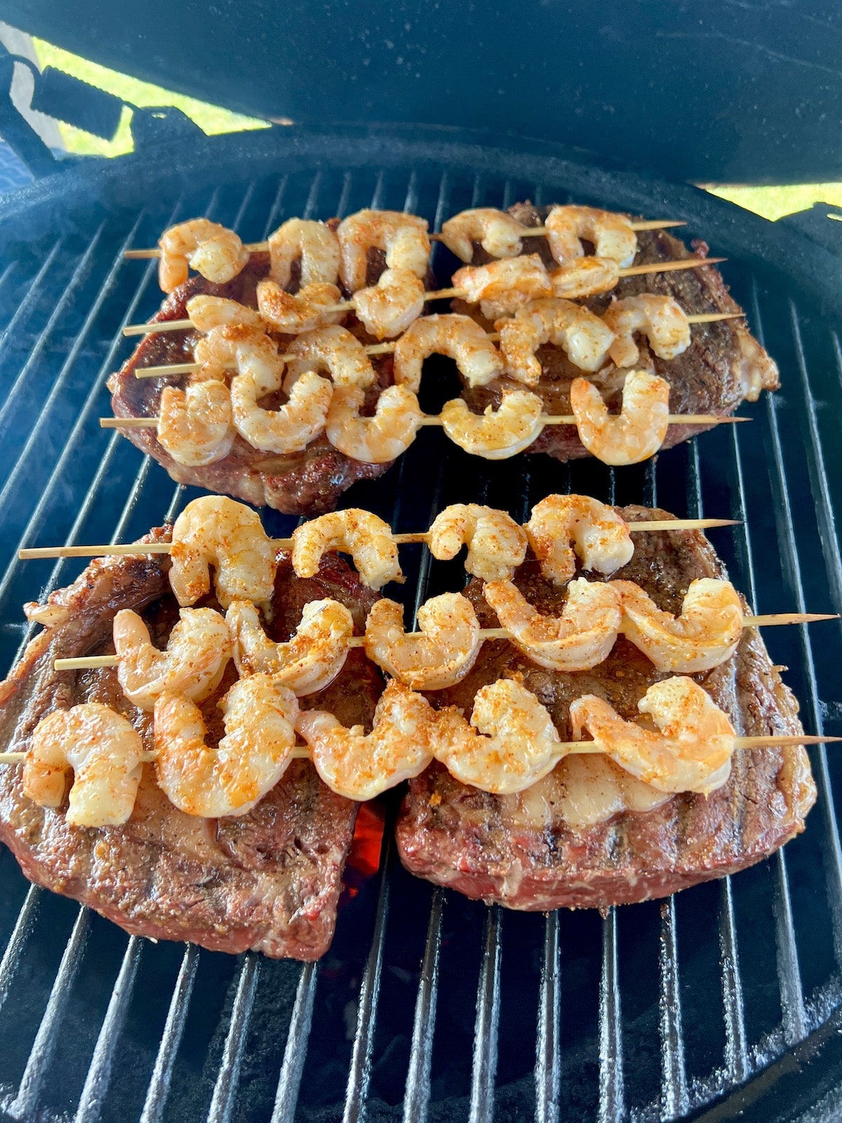 Grilled Ribeyes with shrimp skewers.