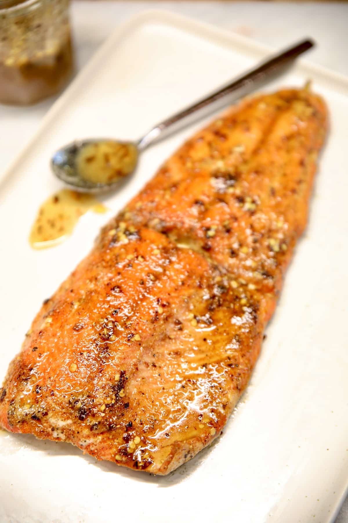 Hot honey glazed salmon on a tray.