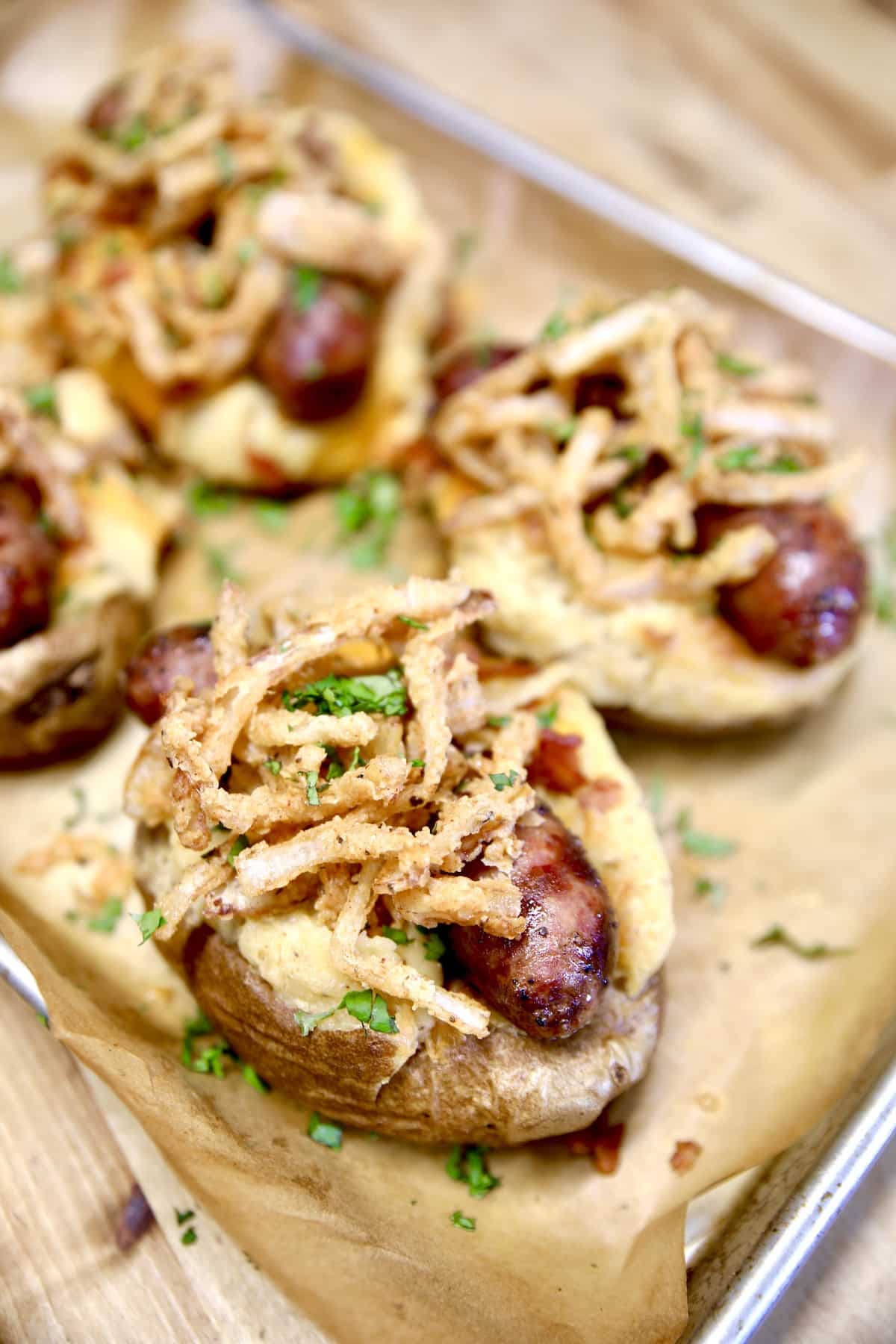 Loaded potatoes with sausage and onions.