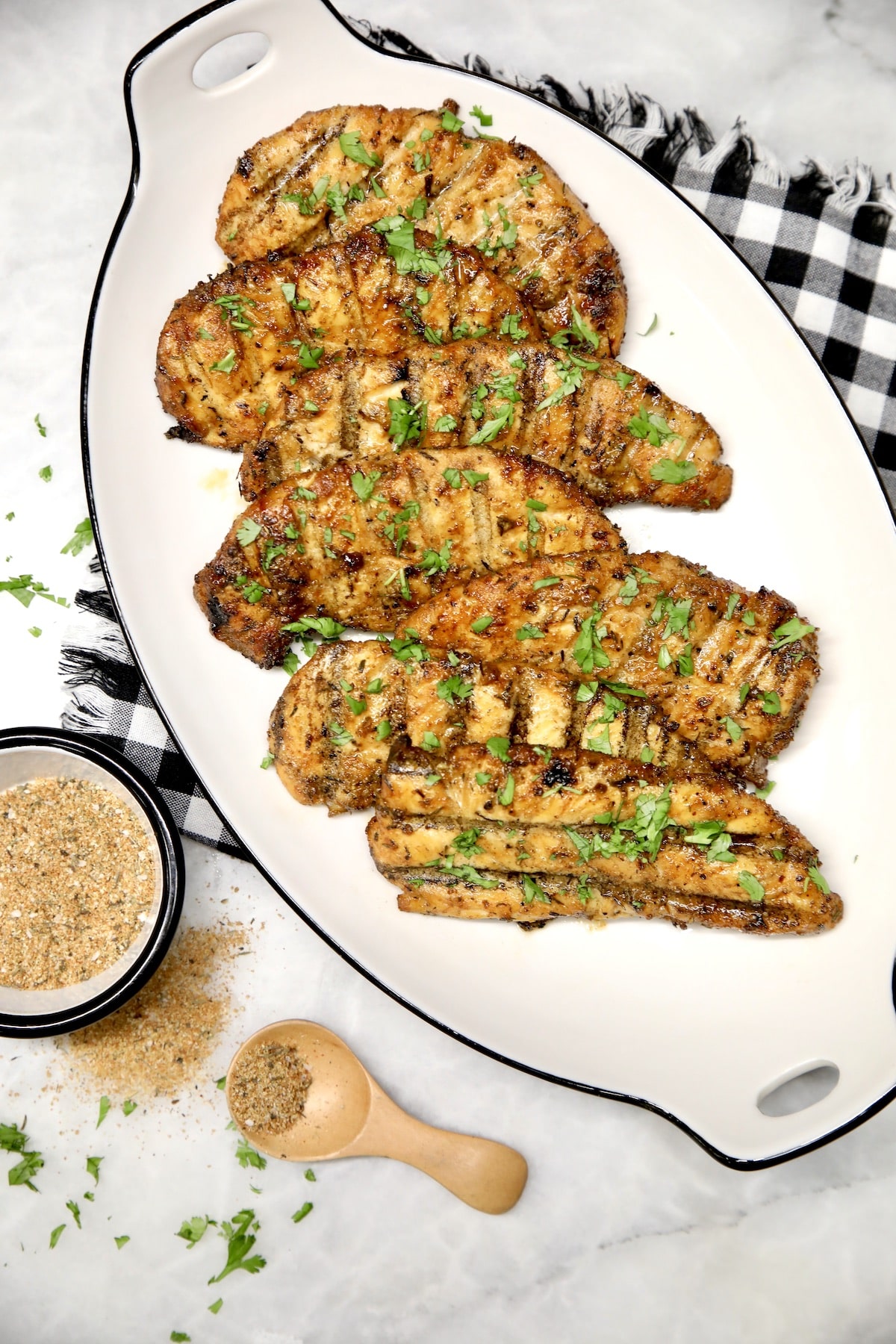 Grilled chicken tenders on a platter.