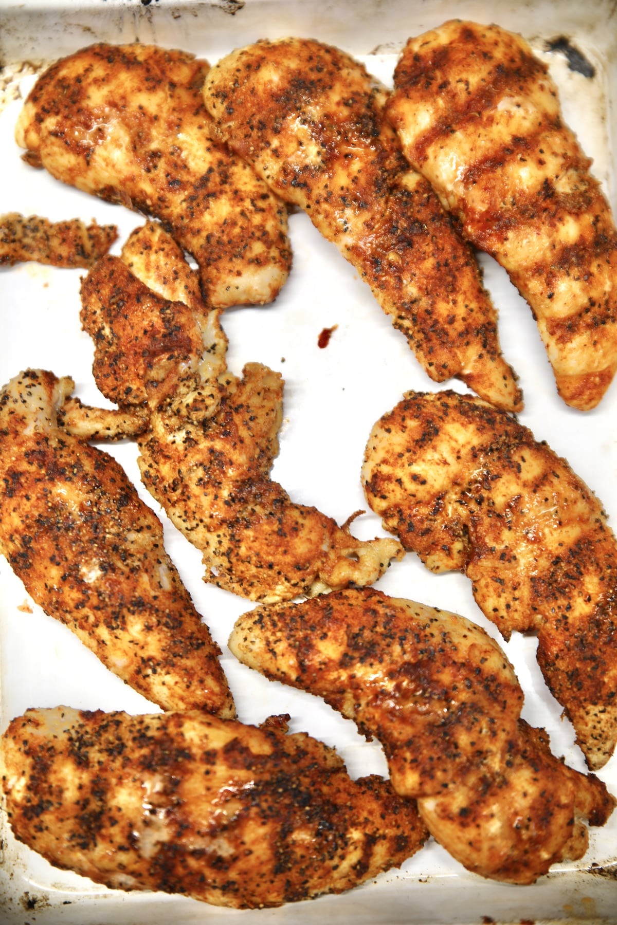 Chipotle grilled chicken tenders on a platter.