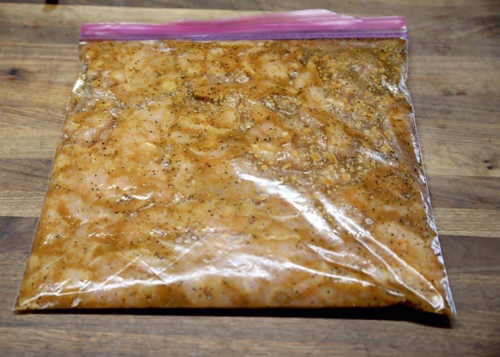 Bag of marinating turkey breast slices.