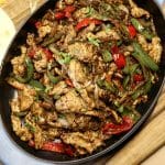 Turkey fajitas in an oval casserole dish.