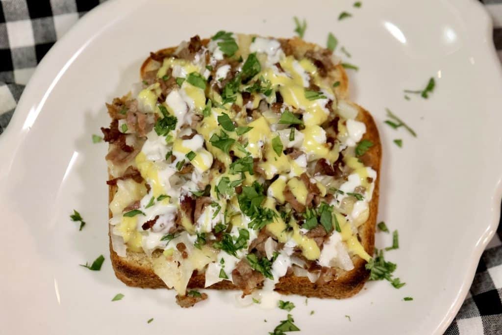 Open faced toasted sandwich with ranch and honey mustard.