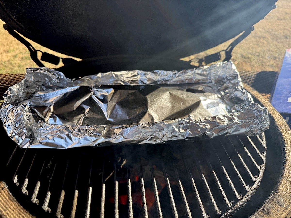 Aluminum foil packet of salmon.