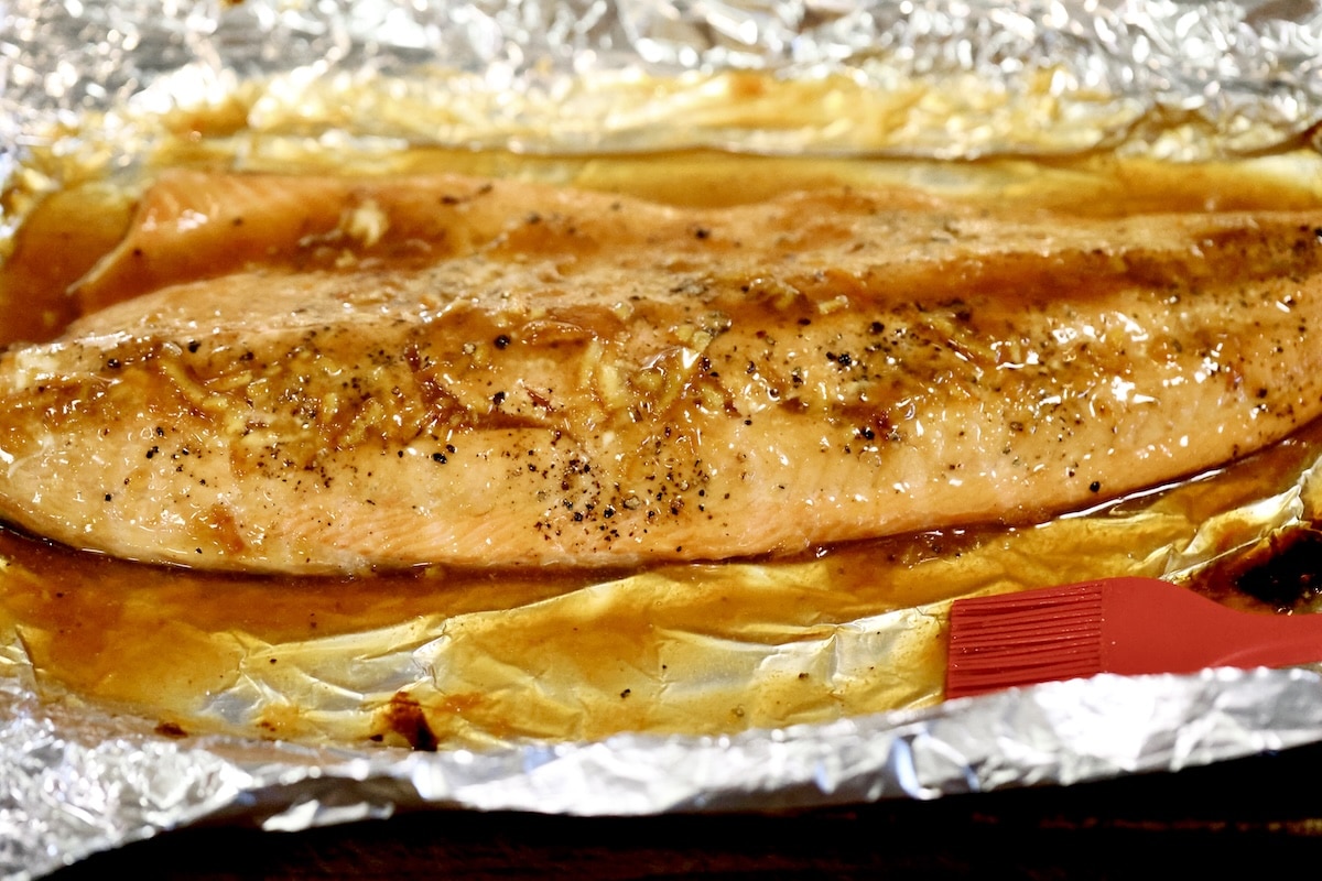 Foil packet of orange glazed salmon.