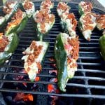 Crab rangoon stuffed peppers on a grill.