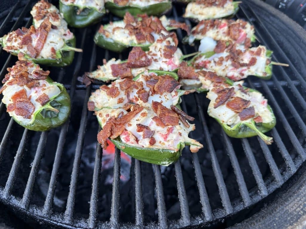 Stuffed poblanos on grill.