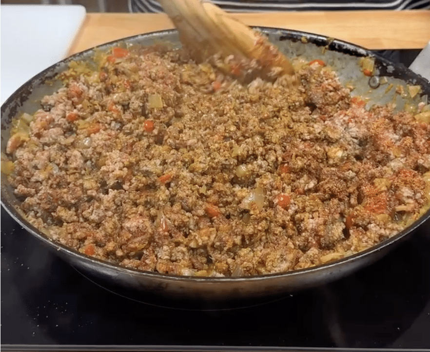 Ground beef mixture in a skillet for chili.