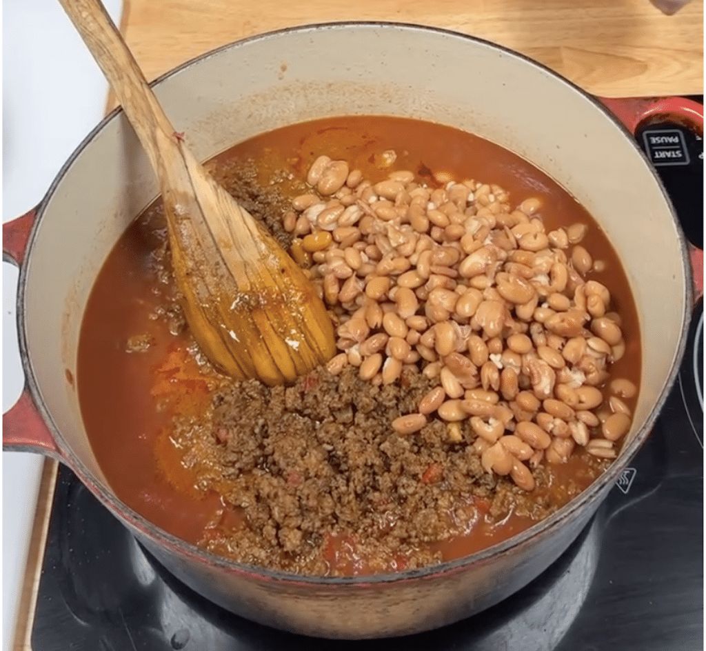 Dutch oven with chili meat and beans.